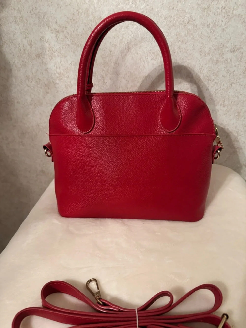 bebe Red Pebbled Fabiola Leather Satchel with Gold Logo Accent with strap.